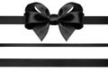 Black ribbon with gift bow isolated on white. Christmas festive bow of black shiny satin ribbon and horizontal lines of