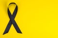 Black ribbon is symbol of fight against melanoma and skin cancer Royalty Free Stock Photo