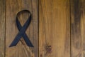 Black ribbon is symbol of fight against melanoma and skin cancer Royalty Free Stock Photo