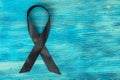 Black ribbon-symbol of fight against melanoma and skin cancer Royalty Free Stock Photo