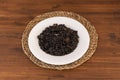 Black rice paella with prawns and squid on a white plate Royalty Free Stock Photo