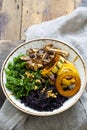 Black rice with roasted delicata squash, massaged kale and shiitake mushrooms Royalty Free Stock Photo