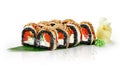 Black rice sushi rolls with salmon, eel, unagi sauce and sesame on bamboo leaf Royalty Free Stock Photo