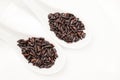 Black rice texture and spoons Royalty Free Stock Photo