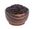 Black rice in wooden bowl isolated on white background Royalty Free Stock Photo