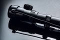 Black rifle optical sight on black background