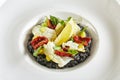 Black Risotto with Octopus and Sun Dried Tomatoes Royalty Free Stock Photo