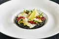 Black Risotto with Octopus and Sun Dried Tomatoes Royalty Free Stock Photo