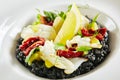 Black Risotto with Octopus and Sun Dried Tomatoes Royalty Free Stock Photo