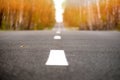 Black road panorama on sunny autumn evening. Selective focus Royalty Free Stock Photo