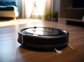 A black robotic vacuum cleaner on a wooden floor, set against the backdrop of a modern living room with a blue sofa and