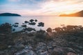 Black rock beach during sunset scene