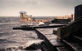 Black rock diving tower, Salthill beach, Galway bay, Dramatic stormy sky over the ocean`s water Royalty Free Stock Photo