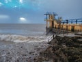 Black rock diving tower, Salthill beach, Galway bay, Dramatic stormy sky over the ocean`s water Royalty Free Stock Photo