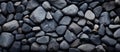 Black rocks stacked resemble cobblestone road surface Royalty Free Stock Photo