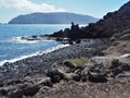 Black volcanic beach and view of Lanzarote from La Graciosa, Canary Islands