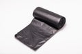 Roll of black dustbin liners isolated on a white background Royalty Free Stock Photo