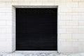 Black roller shutter door of the store is closed