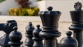 A black Rook chess piece ready to move against an opponent Royalty Free Stock Photo