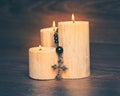 Black rosary on the Candle close up