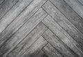 Black rough wooden background, parquet floor herringbone pattern