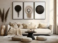 Black round accent coffee table near white sofa against of stucco, wall with three art poster frames. Boho interior design of Royalty Free Stock Photo