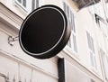 Black and round logo sign on the wall