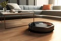 Black round robot vacuum cleaner cleans room