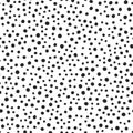 Black round spots scattered on white background. Seamless pattern. Irregular polka dot. Royalty Free Stock Photo