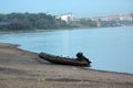 Black motor boat on the river bank. Travelling concept