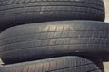 Black rubber tires stacked, car wheel, garbage from vehicles, abstract art background Royalty Free Stock Photo