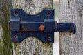 Black iron latch on a wooden fence Royalty Free Stock Photo