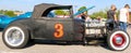 Black 1940's Ford T-bucket antique convertible car.