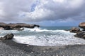 Black Sand Beach with Lava Rock on the Coast of Aruba Royalty Free Stock Photo