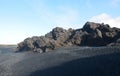 Black Sand Beach and Black Lava Rock Formations Royalty Free Stock Photo