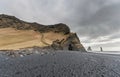 Black Sand Beach Reynisfjara in Iceland. Rocks in Water. Ocean Waves Royalty Free Stock Photo