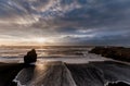 Black Sand Beach Reynisfjara in Iceland. Windy Morning. Ocean Waves. Wide Angle. Sunrise.