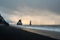 Black sand beach of Reynisfjara and the mount Reynisfjall from the Dyrholaey promontory in the southern coast of Iceland