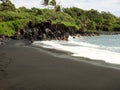 Black sand beach on road to Hana Maui Hawaii Royalty Free Stock Photo