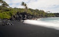 Black sand beach on road to Hana Maui Hawaii Royalty Free Stock Photo