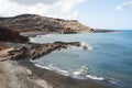 Black sand beach on the rocky point of El Golfo on the island of