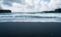 Black sand beach at Waianapanapa on the road to Hana in Maui Royalty Free Stock Photo