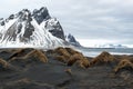 Black sand dunes and Vestrahorn mountain, ocean shore on the Stokksnes Peninsula, Iceland Royalty Free Stock Photo