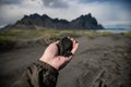 Black sand on hand and Vestrahorn Background , Iceland Summer.