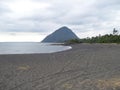 Black sand, peaceful place, grey clouds in Santa Barbara's beach Chili Royalty Free Stock Photo