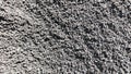 Black sand texture piled up to buid a house