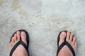 black sandals on the cement floor