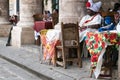 Black Santero Priest Afro-Caribbean Religion sitting in the street of La Havana, Cuba