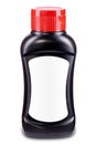 Black sauce bottle with red flip-top cap and blank white label isolated on white background. Template for product design. Ketchup Royalty Free Stock Photo