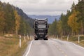 Black Scania truck driving at road